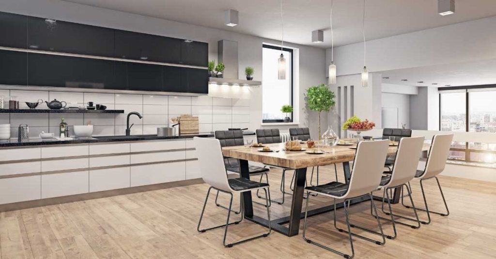 big modern kitchen, open space with dining table, wooden floor, white and black kitchen