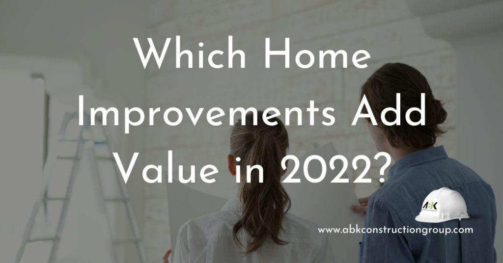 which home improvements add value - two people painting the walls